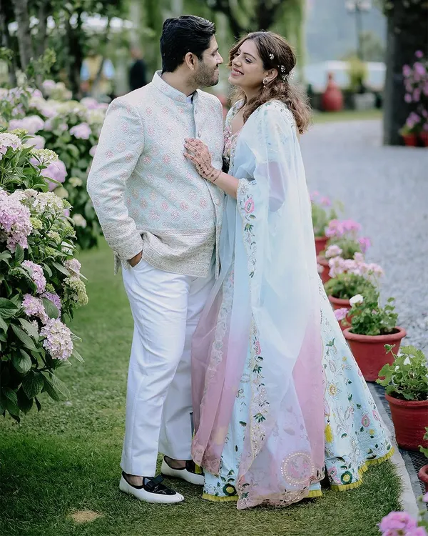 A beautiful portrait from a destination engagement in Nainital. The couple is surrounded by a garden of pastel flowers that perfectly complements their elegant outfits.