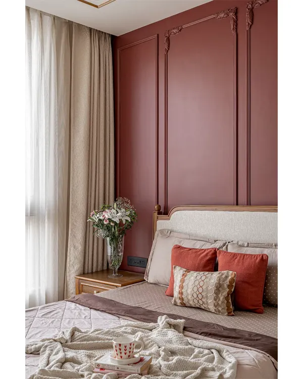 A closer look at the bedroom we designed. The rich burgundy accent wall with classic molding pairs beautifully with the custom bed and side table I built. The goal was to create a space that feels both grand and comfortable.