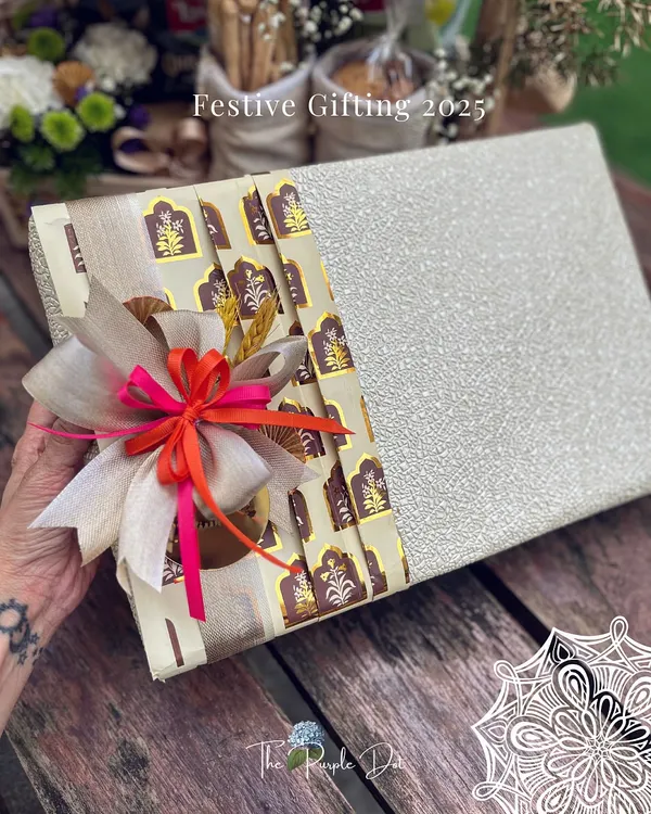 A festive gift box for Diwali 2025, showcasing my signature wrapping style. I combined textured paper with a traditional printed band and a multi-layered ribbon bow for a look that is both modern and rooted in celebration.