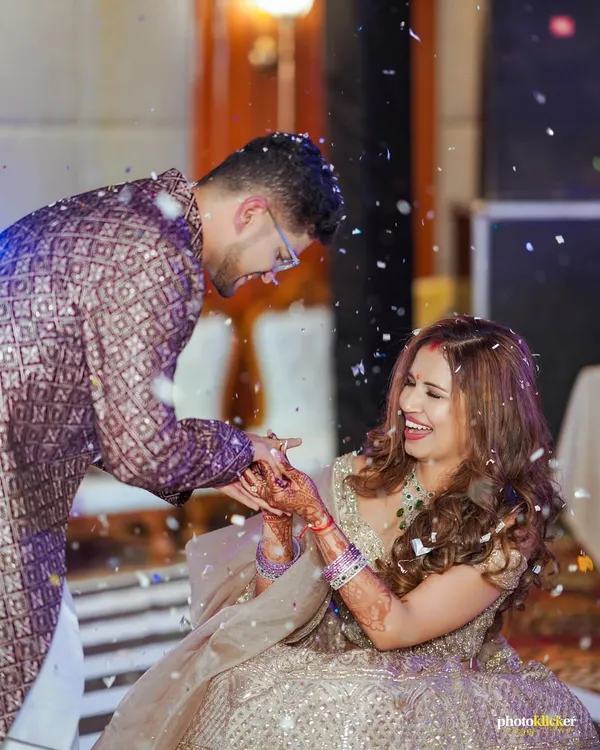 A moment of pure, unscripted laughter during an engagement ceremony. We aim to capture the genuine joy and connection between our couples.