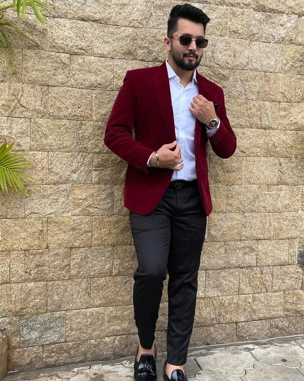 Rocking a sharp red velvet blazer for a wedding event. My personal style is about looking confident and ready for any celebration, just like my choreography.