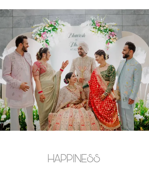 A beautiful, happy portrait of the couple with their family. These are the cherished photos that will be framed for generations.