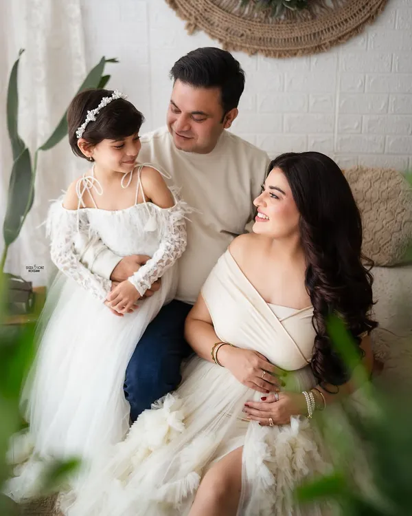 Squad goals. This beautiful family portrait with their daughter is just perfect. I love capturing the sweet interactions as they await their new arrival.