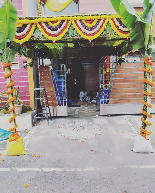 A classic entrance for a housewarming ceremony. We use banana plant pillars, a traditional coconut leaf canopy, and marigold garlands to create a welcoming and sacred space for your guests.