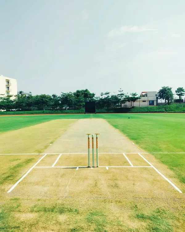 The calm before the storm. A perfectly prepared cricket pitch at a beautiful venue, ready for the opening match of the season. We ensure top-tier facilities for our leagues.