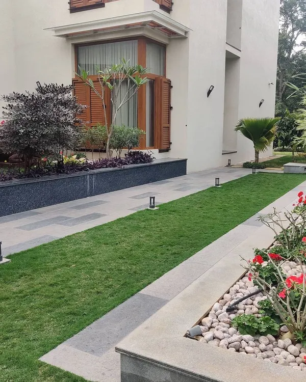 A carefully manicured garden path in one of our urban residential projects. We design landscape spaces that are both visually pleasing and functional, encouraging residents to spend more time outdoors.