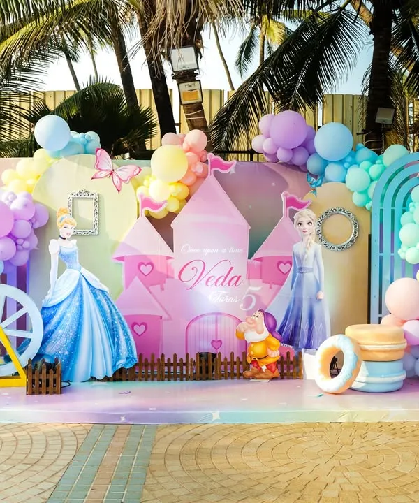 A magical Disney Princess stage set against a beautiful outdoor backdrop, featuring Cinderella, Elsa, Belle, and a stunning castle centerpiece for a truly royal celebration.