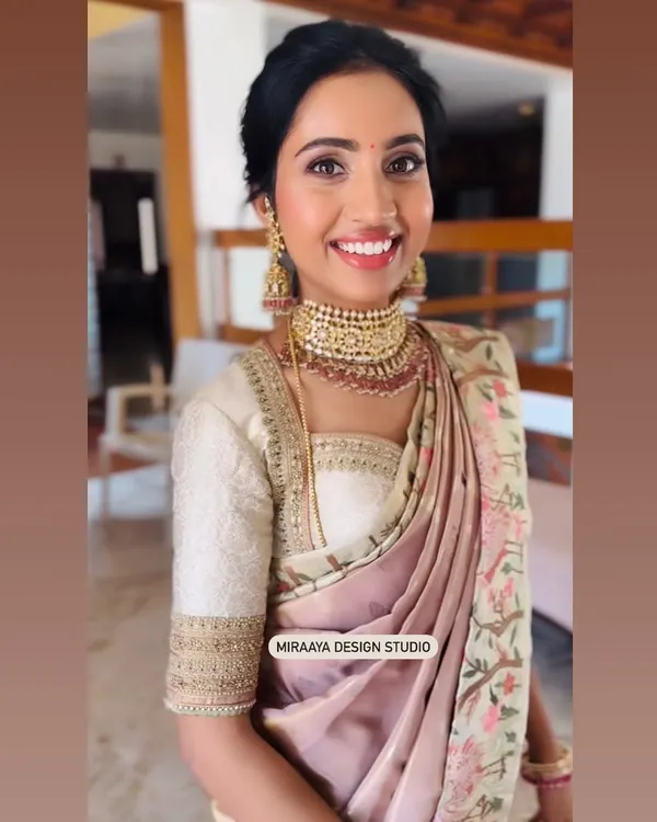 A happy client ready for a wedding. I designed this custom embroidered blouse to pair with her beautiful floral saree, creating a soft and elegant look.