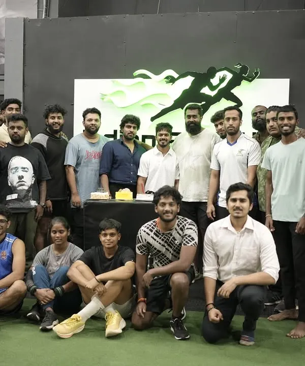 This is our tribe. A candid moment with our athletes and coaches celebrating together at our gym. We are more than just a training center; we are a community that supports each other through the daily grind and celebrates every victory, big or small.