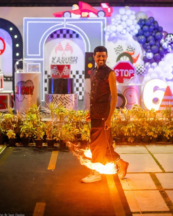 Let's heat things up! This incredible fire dancer made for a truly "lit" moment at the race car party. This kind of high-energy entertainment is perfect for wowing older kids and adults.