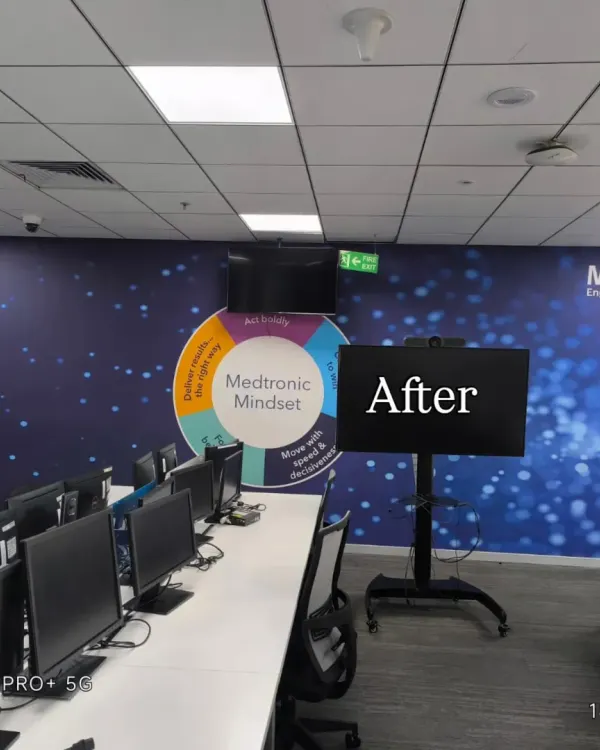 The 'after' shot of a Medtronic office, where I installed a large, branded "Mindset" mural to energize the workspace.