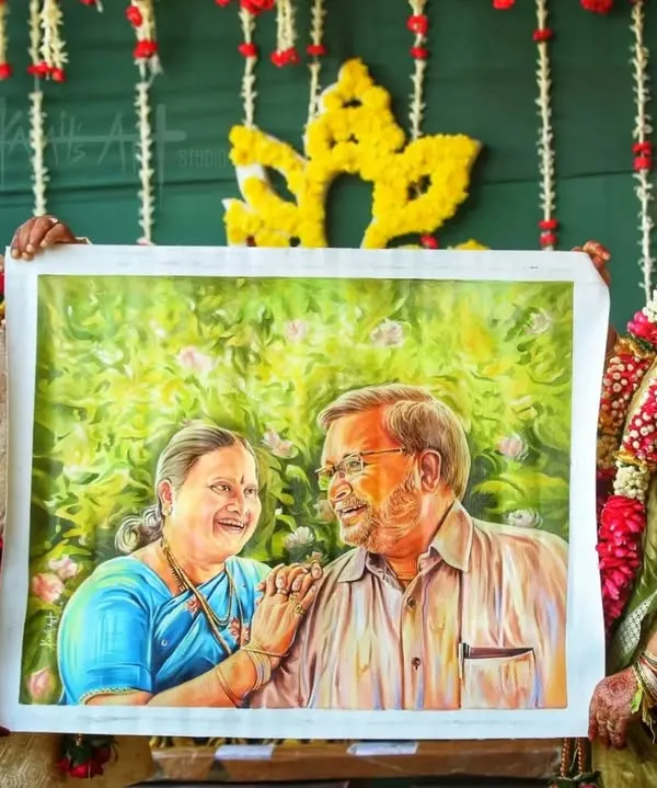 This happy couple is celebrating their anniversary with a custom oil painting I created for them, a gift from their son to cherish their bond.