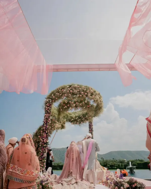 A breathtaking Anand Karaj ceremony at Raffles Udaipur. The pastel floral mandap, set against the serene lake and hills, created a truly heavenly atmosphere for the couple's vows.