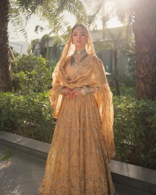 A vision of heritage and grace. I styled this regal golden lehenga to capture a timeless bridal look, focusing on the intricate embroidery and pairing it with a stunning emerald and pearl necklace for a touch of royalty.