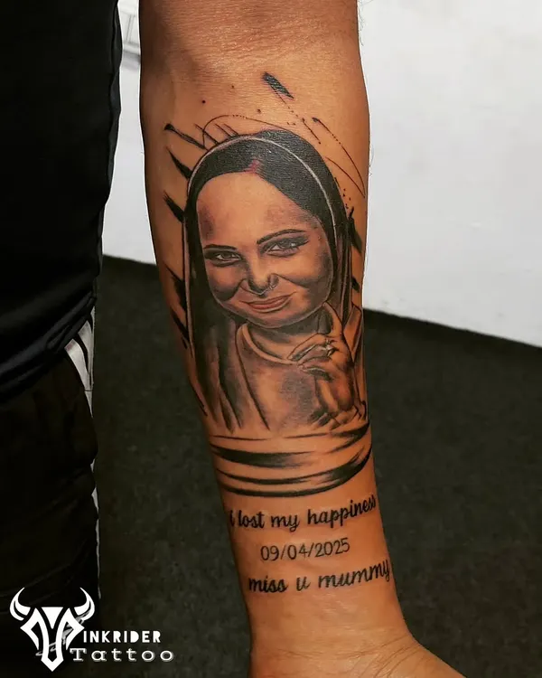 A touching memorial portrait tattoo for a client's mother. We specialize in capturing likeness and emotion to create a lasting tribute that keeps their memory alive.