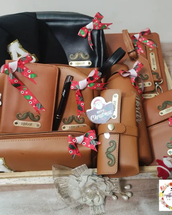 This is one of my favorite hampers to create, packed with 13 different personalized leatherette items for a fan to gift to actor Abrar Qazi. It includes everything from a wallet and passport cover to a custom-named cap and bottle, all tied together with a festive Christmas theme.