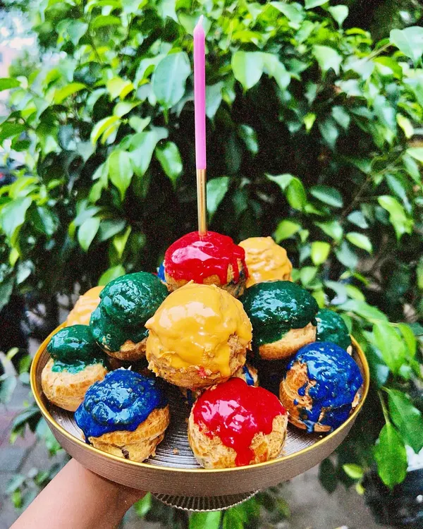 Here’s your sign to skip the cake and go for a tower of cream-filled happiness instead. My choux pastries are available in multiple flavors and make for a fun, colorful centerpiece.