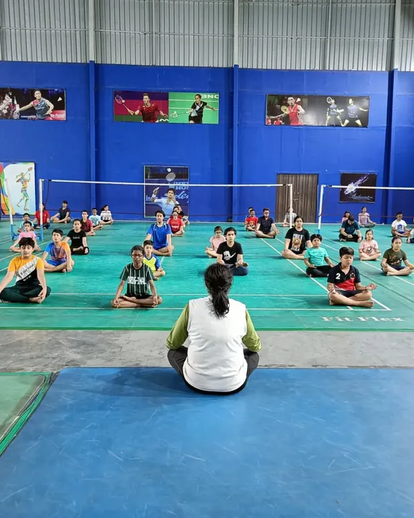 A view of our yoga session from the instructor's perspective. We guide players through poses that specifically benefit a badminton player's range of motion and core strength.