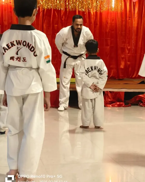 A moment of focus and respect during a belt promotion test. A student stands before the examiner, ready to demonstrate his skills.