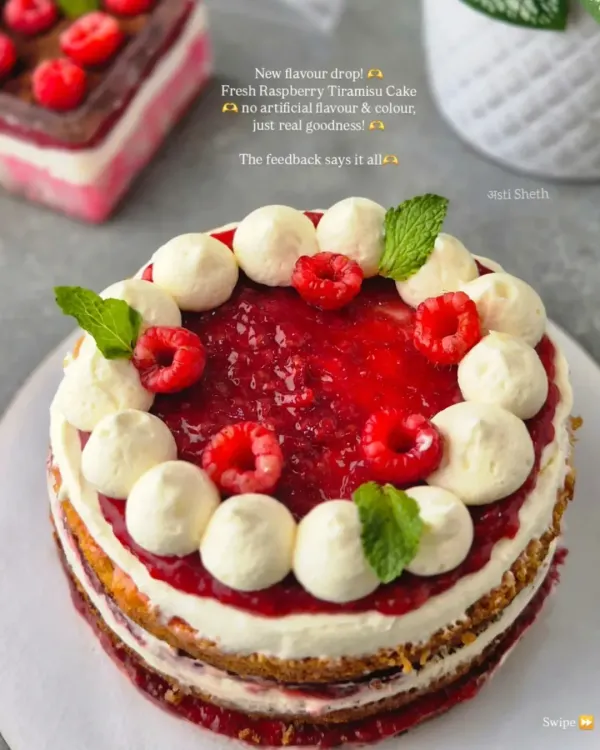 This is my Fresh Raspberry Tiramisu Cake, a new favorite. It’s a rustic, naked cake featuring layers of light sponge, creamy egg-free tiramisu filling, and a vibrant topping of fresh raspberry compote and whole berries. I never use artificial flavors, just pure indulgence.