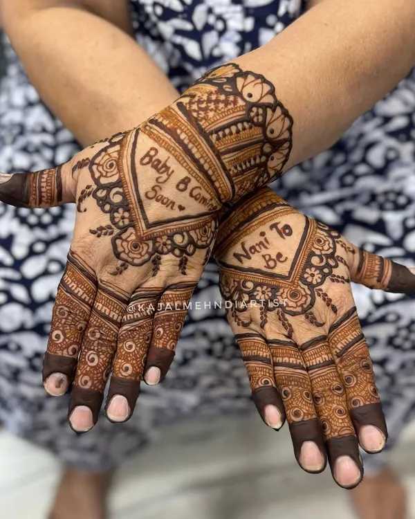 Henna for the Nani to Be! What a sweet way to celebrate a new arrival. This design has "Baby Coming Soon" and "Nani to Be" written in the palms, surrounded by heart-shaped patterns.