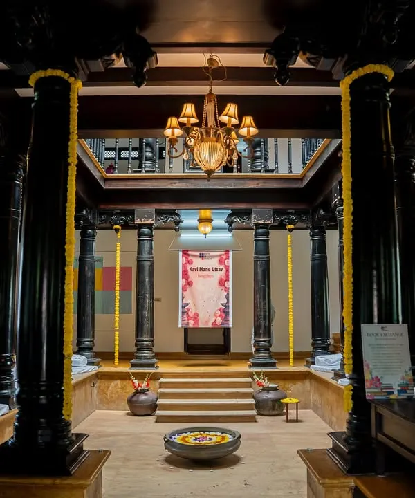 The stunning central courtyard of the heritage home for Kavi Mane Utsav, set up for an immersive poetry experience. We find venues that tell a story of their own.
