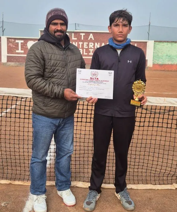 Anay Pandey with his coach after a remarkable performance at the CS7 Tournament in Sonipat. This partnership between player and coach is fundamental to achieving success on the AITA junior tour.