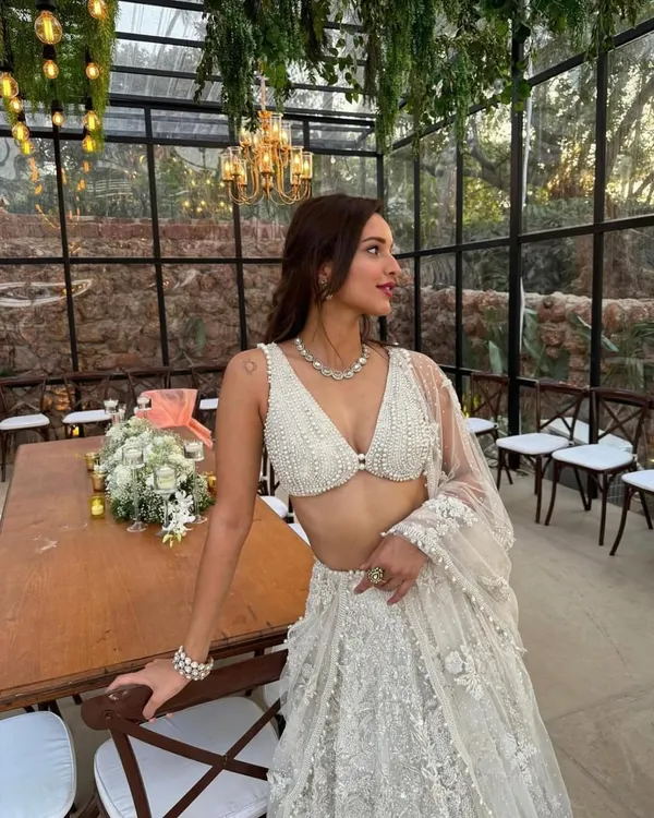 An ethereal white lehenga perfect for a daytime wedding or elegant reception. I styled this with delicate pearl and diamond jewelry to enhance its sophisticated, angelic feel.