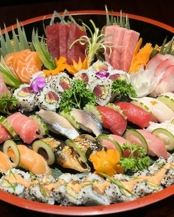 Our grand sushi and sashimi party platter is a celebration on its own. It features a rich assortment of our finest offerings, including Tuna Akami, Hamachi, Salmon, and various signature rolls, making it the stunning centerpiece for any special occasion.