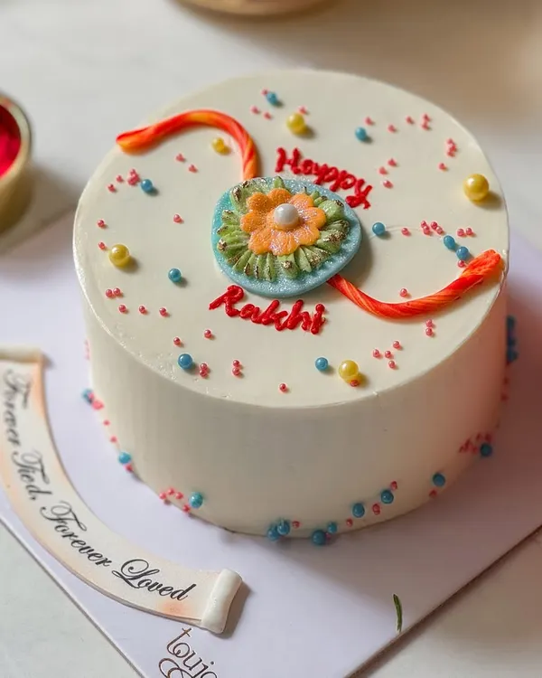 Our special Rakhi Mini Cake, decorated with an edible rakhi design. It's a sweet and thoughtful way to celebrate the bond between siblings, complete with a fondant message of "Forever Tied, Forever Loved."
