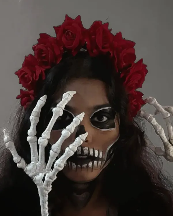 The Calavera Catrina look is all about the details. Here, the skeleton hands frame the face, adding to the spooky and artistic vibe. This kind of costume styling is perfect for making a huge impact at a theme party.