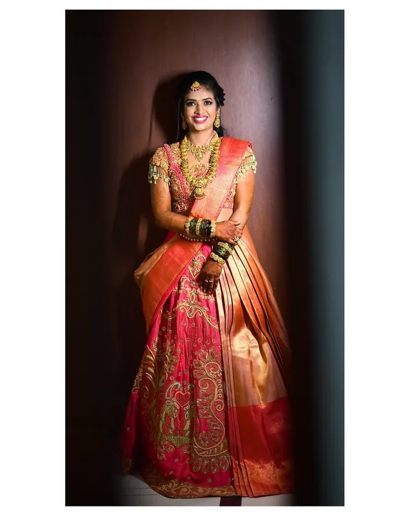 A beautiful client on her wedding day in a custom Yukba half-saree lehenga. Her happiness and confidence are what I strive for with every design.