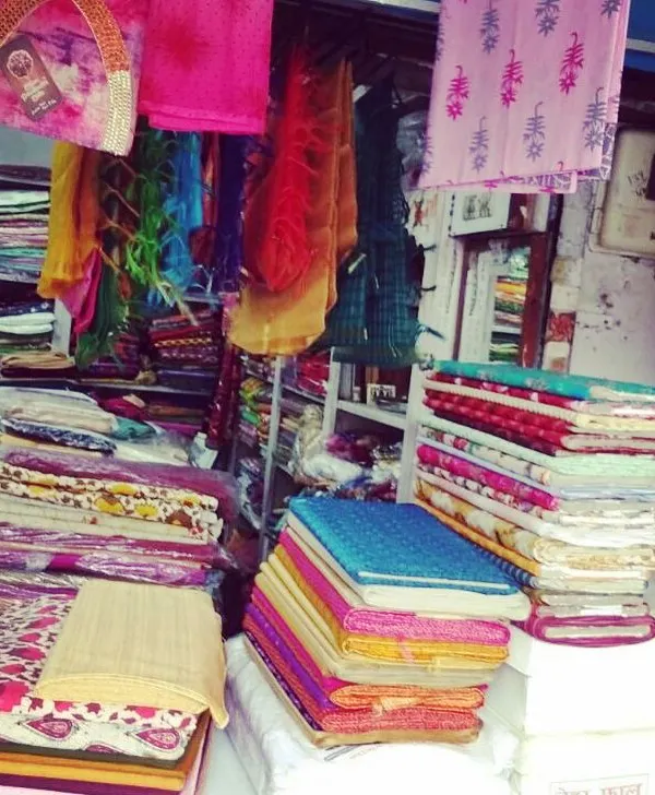 A glimpse into my workshop where I keep a wide variety of fabrics. You can choose from my collection or bring your own material for stitching.