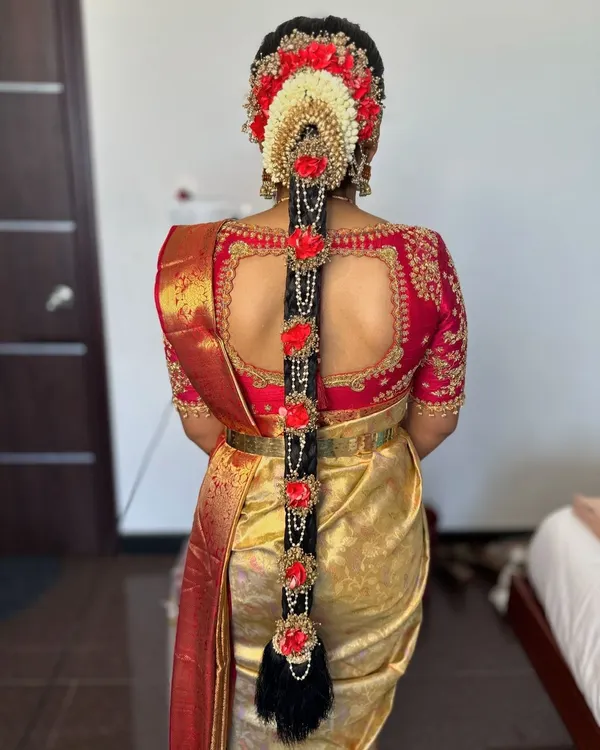 A detailed view of a classic South Indian bridal braid I created for Prerana. The combination of fresh flowers and traditional hair jewelry makes for a truly showstopping look.