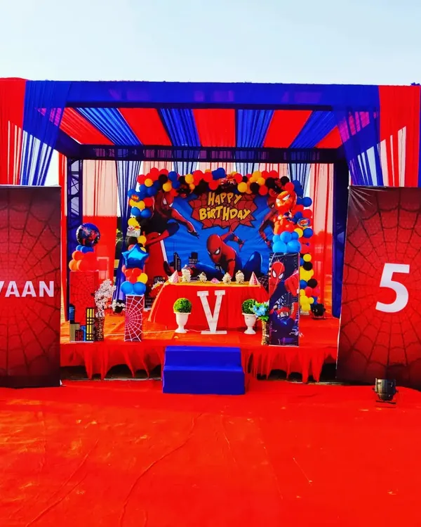 This Spiderman themed birthday party shows our complete execution. We built the stage, designed the backdrop, arranged the tent, and provided custom banners with the birthday boy's name and age.
