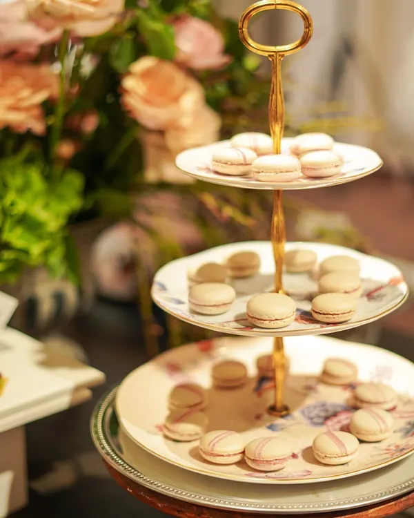 A three-tiered stand of our delicate raspberry and vanilla macarons. These were a highlight at a recent fashion event, adding a touch of Parisian elegance to the dessert selection.