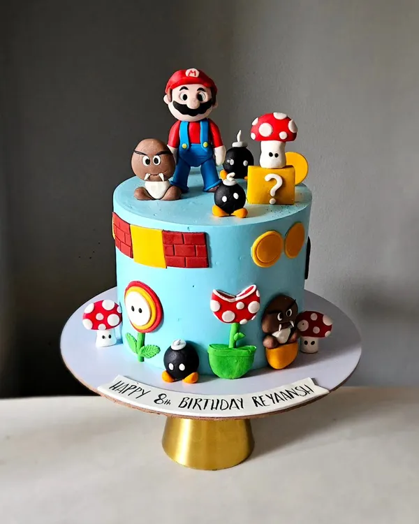 It's-a-me, Mario! This Super Mario themed cake is packed with detail, featuring handcrafted figurines of Mario, Goombas, piranha plants, and question blocks. It took hours to create all these iconic, edible elements.