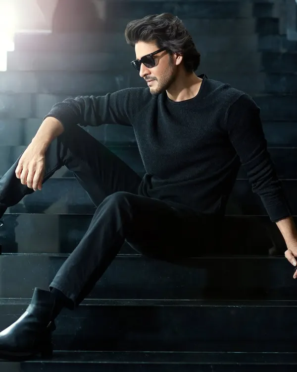 A moody, backlit portrait of actor Mahesh Babu for Hello! Magazine. The strong silhouette and minimalist all-black styling create a sense of modern, understated power.