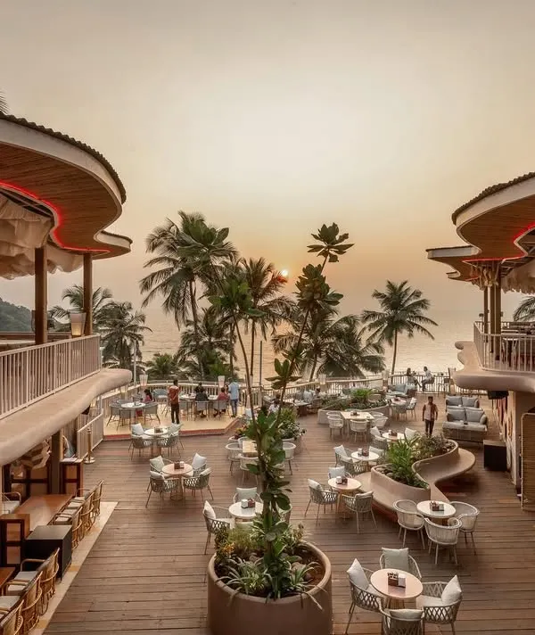This is our award-shortlisted project, Dubki, in Goa. The design is inspired by the movement of ocean waves, with a flowing fabric-like roof and organic forms that open up to a stunning view of the sea. It's a space that transforms from a serene dawn-to-dusk restaurant to a high-energy nightclub after sunset.