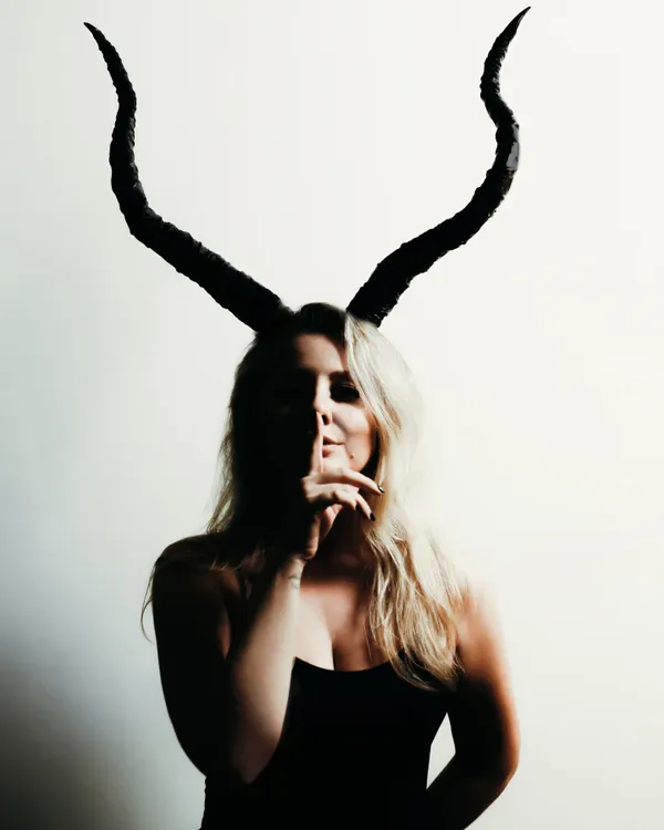 A creative shot for my birthday, embracing my Capricorn identity. This photo captures the darker, more artistic side of my brand.