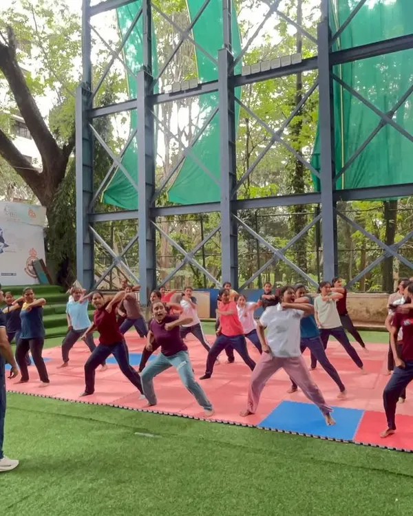 An instructor leads a group of women through foundational stance and movement drills. Mastering these basics is the first step toward developing balance and stability, which are crucial for any self-defense action.