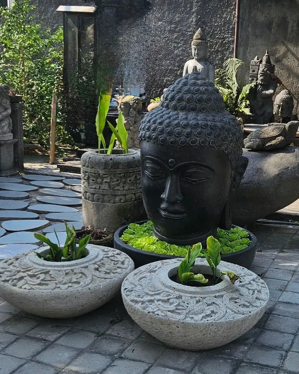 Our search for unique decor takes us to faraway places. Here is a collection of hand-carved stone planters and a large Buddha head, perfect for creating an authentic Balinese-style garden.