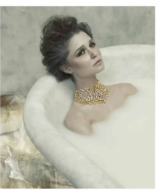 This image is from my "Sculptured Portraits" series, where I explore the intersection of art and photography. The concept was to treat the subject like a classical sculpture, using the milky bath to create texture and the exquisite jewelry as the focal point. It's about creating a timeless piece of art.