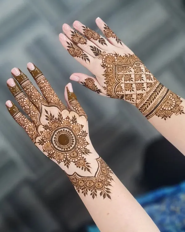 The definition of beauty. This design features a stunning central mandala on one hand and a geometric cuff on the other.