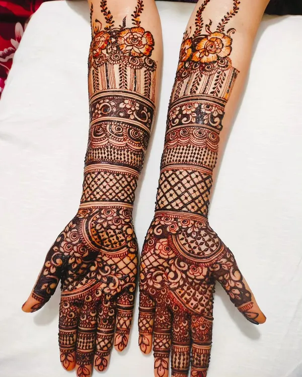 A stunning full-arm design for a beautiful bride. We combined traditional bands, delicate netting, and floral patterns for a classic and elegant bridal look.