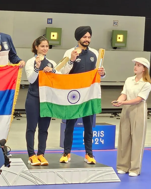 A moment of immense national pride. My students Manu Bhaker and Sarabjot Singh on the podium at the Paris 2024 Olympics, holding the Indian flag after winning the bronze medal. This is the result of years of relentless effort and world class preparation.