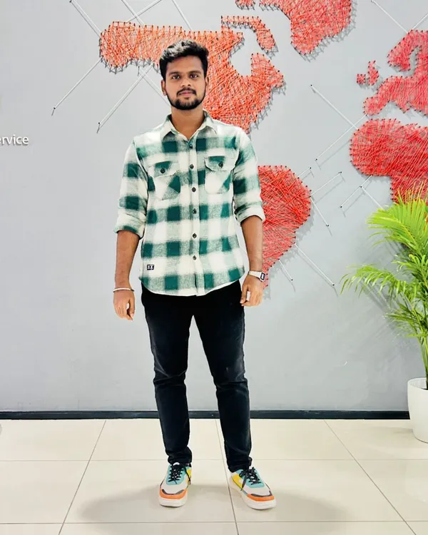 In front of the global network map at the BDO office. My experience is backed by a global standard of excellence, which I apply when offering small business tax advice and strategic planning.