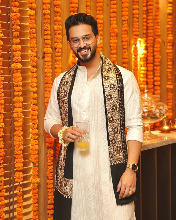 Wishing everyone a Happy Diwali! This client celebrates the festival of lights in a custom off-white kurta paired with a stunning black stole featuring intricate traditional embroidery.