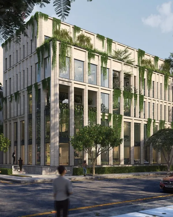 A render for an upcoming commercial project in Koramangala, featuring a limestone facade with integrated planters that allow greenery to cascade down the building. This concept explores how architecture can merge with the natural landscape in an urban context.