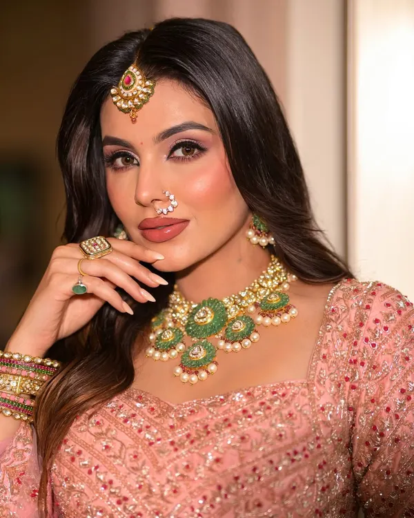 This is the epitome of timeless elegance. I focused on creating a flawless, radiant skin base with soft, romantic pink tones on the eyes and lips, perfect for an engagement or wedding day look that feels both modern and classic.